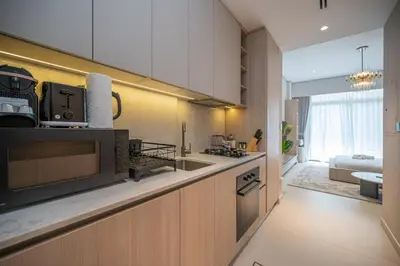 a kitchen with a microwave and a counter top at Modern Studio Apartment for Rent Fully Furnished in Dubai