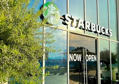 a starbucks sign on the side of a building at Elegant 1BHK Dubai Private Beachfront in Dubai
