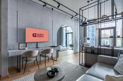 a living room with a couch and a table at GuestReady - Canal View Studio | Near Downtown in Dubai