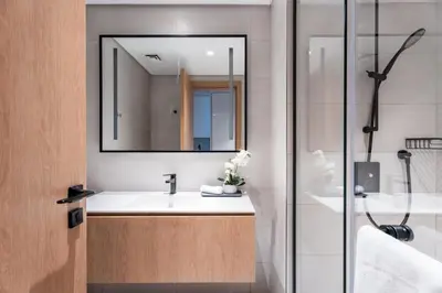a bathroom with a sink and a mirror at GuestReady - Canal View Studio | Near Downtown in Dubai