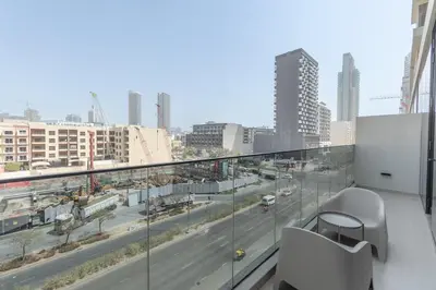 a balcony with a view of a city street at Modern Aura Living Chic 1BR Hideaway in JVC in Dubai