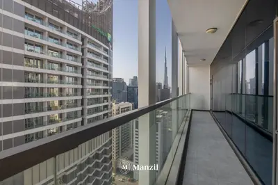 a balcony of a building with a view of the city at Luxury 2BR Apartment in Business Bay with Pool, Sauna and Burj Khalifa View in Dubai