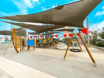 a park with a playground with a swing at FAM Living - Urban Stays - MAG318, 5 mins to Burj Khalifa in Dubai