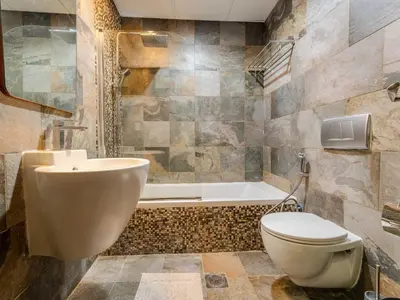 a bathroom with a toilet and a sink and a tub at Luxury in Dubai Marina 1BR beside Vida Yacht Club in Dubai