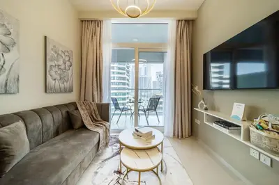 a living room with a couch and a table at Airstay - Cozy 1BR - Canal View - Business Bay - Monthly Offer Available in Dubai