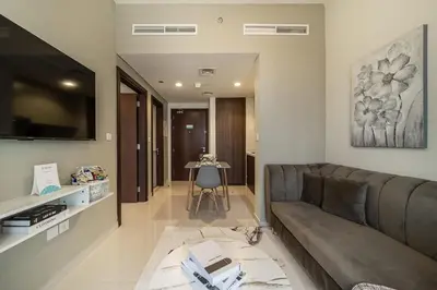 a living room with a couch and a table at Airstay - Cozy 1BR - Canal View - Business Bay - Monthly Offer Available in Dubai