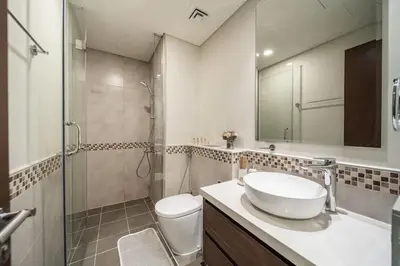 a bathroom with a sink and a shower and a toilet at Airstay - Cozy 1BR - Canal View - Business Bay - Monthly Offer Available in Dubai