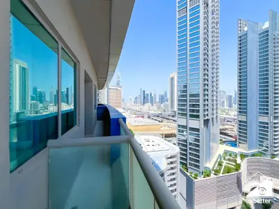 a balcony with a view of a city at Elegant 2-Bed Retreat, Stunning Downtown Views in Dubai