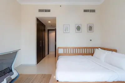 a bedroom with a bed and a flat screen tv at Great Location - Stunning Views - Scenic in Dubai