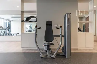 a gym with a black chair in a room at Luxury Apartment in the Heart of the City in Dubai