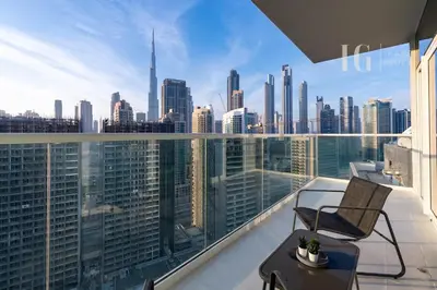 a balcony with a chair and a view of the city at Modern Comfort in Business Bay in Dubai