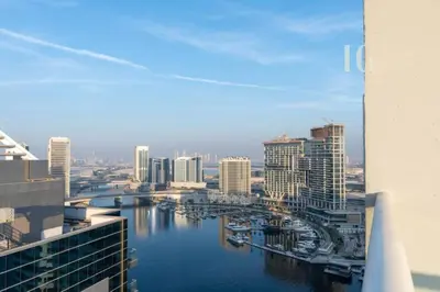a view of a city with a river and buildings at Modern Comfort in Business Bay in Dubai