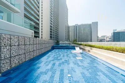 a swimming pool in the middle of a building at Modern Comfort in Business Bay in Dubai