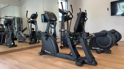 a gym with several tread machines in a room at Rosewater at Creek Beach Building 2 Luxury Creekside Living with Beach & Pool Access in Dubai