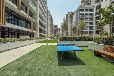 a ping pong table in the middle of a building at Azizi Riviera Gateway - Highest Floor Superior Apartment in Dubai