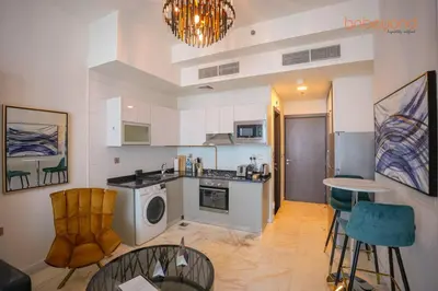 a kitchen with a washer and dryer in a room at Bnbeyond Contemporary Living in Business Bay in Dubai