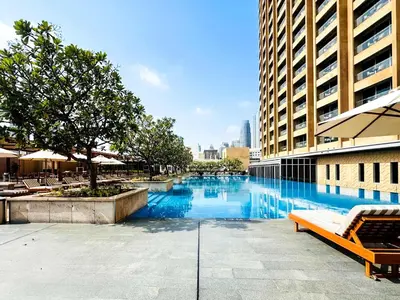a swimming pool in the middle of a building at PVH - Emaar Fashion Avenue - 1BR Dubai Mall Access in Dubai