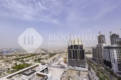 an aerial view of a city with tall buildings at Bloomfields Fantastic Stu Binghatti Azure in Dubai