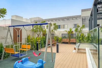 a playground with a swing and a swing set at FIRST CLASS Studio Minimalist Chic Retreat in Dubai