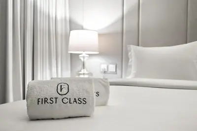 a hotel room with a first class pillow on a bed at FIRST CLASS 1BR Majestic Marina Views in Dubai