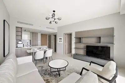 a living room with white furniture and a fireplace at FIRST CLASS 1BR Majestic Marina Views in Dubai