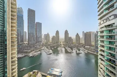 a view of a harbor in a city with boats at FIRST CLASS 1BR Majestic Marina Views in Dubai