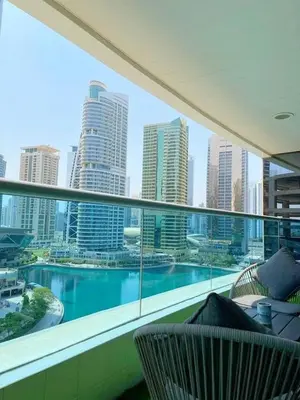 a balcony with a view of a city skyline at Stunning lake view 1bedroom apartment in Jlt in Dubai