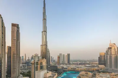a view of a city skyline with a tall skyscraper at FIRST CLASS 2BR Burj Views & Classy Comfort in Dubai