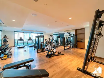 a gym with several treadmills and cardio machines at Skyline Elegance, Fountain View 3BR in Downtown in Dubai