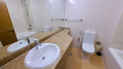 a bathroom with a sink and a toilet at DRUVYA HOLIDAY HOMES, Building No 194, Street No,10 Discovery Gardens, Close to Al Furjan Metro 3 minutes walkable in Dubai