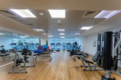 a gym with several treadmills and cardio machines at Exceptional 2BR with Marina Waterfront View in Dubai