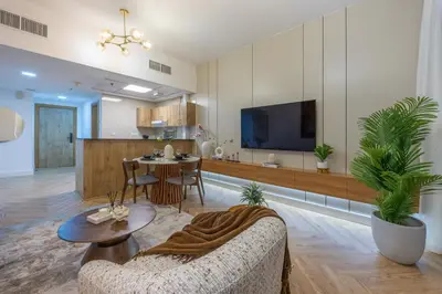 a living room with a couch and a dining room at Exceptional 2BR with Marina Waterfront View in Dubai