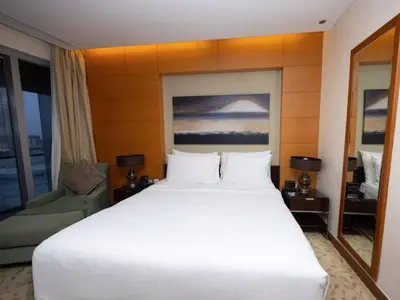 a large white bed in a hotel room at Emaar Residenc Fashion Avenue - Sokoon in Dubai