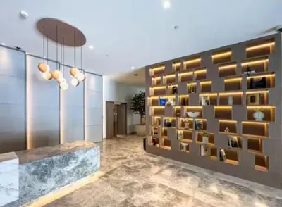a room with a wall of wine bottles at Burj Royale 1BR - Close to Burj Khalifa and Dubai Mall in Dubai