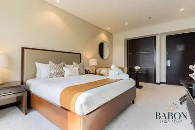 a bedroom with a large bed in a room at The Majestic in Dubai
