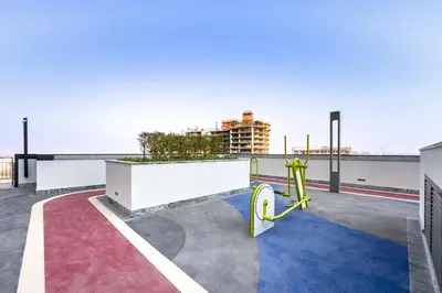 a playground on the roof of a building at 1BR with Maid's Room, Few Minutes Drive to Downtown Dubai, Burj Khalifa, Dubai Mall, Close to Parks and Crystal Lagoons - The Crest Tower C, Sobha Hartland by Deluxe Holiday Homes in Dubai