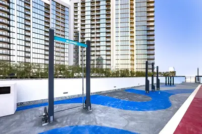 a row of street signs on the roof of a building at 1BR with Maid's Room, Few Minutes Drive to Downtown Dubai, Burj Khalifa, Dubai Mall, Close to Parks and Crystal Lagoons - The Crest Tower C, Sobha Hartland by Deluxe Holiday Homes in Dubai
