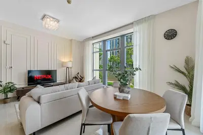 a living room with a couch and a table at Lux Upscale Living Walk to Dubai Mall in Dubai