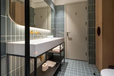 a bathroom with a sink and a mirror at Modern Studio, Burj Khalifa View, Upside Living in Dubai