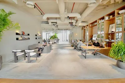 a lobby of a restaurant with people sitting at tables at Modern Studio, Burj Khalifa View, Upside Living in Dubai