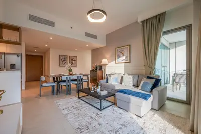 a living room with a white couch and a table at Upscale 2BR with Burj Khalifa Views in Dubai