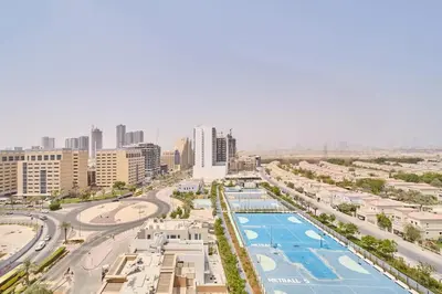 an aerial view of a city with a pool at FAM Living Stylish Studio Apartment in Binghatti Azure JVC in Dubai