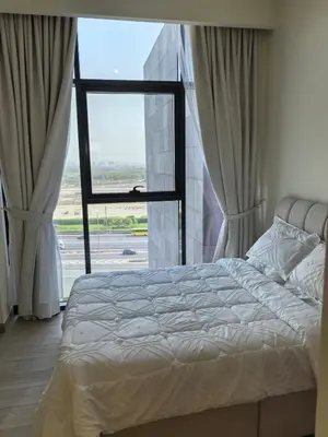 a bedroom with a bed and a large window at Stylish 2B escape in Dubai