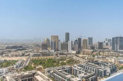 an aerial view of a city with tall buildings at Modern Studio with City Views Near Miracle Garden in Dubai