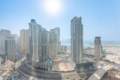 a view of a city with tall buildings at High-Floor Seaview 2BR with Dubai Water Canal Panorama, Steps from Metro and Marina Beach, LIV Marina, Dubai Marina by Deluxe Holiday Homes in Dubai