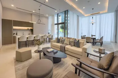 a living room with a couch and a table at High-Floor Seaview 2BR with Dubai Water Canal Panorama, Steps from Metro and Marina Beach, LIV Marina, Dubai Marina by Deluxe Holiday Homes in Dubai
