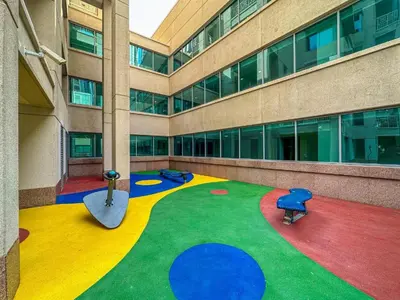 a large building with a colorful carpet in front of it at Luxury Apartment near Dubai Mall & Burj Khalifa at Emaar 29 Boulevard by Simply Comfort in Dubai