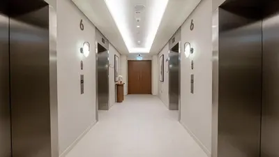 a hallway with elevators in a building with a hallwayngth at Two Bedroom Apartment Down Town in Dubai