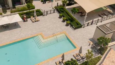 an overhead view of a swimming pool at a hotel at Two Bedroom Apartment Down Town in Dubai