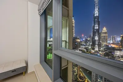 a view of a city skyline from a window at Breathtaking Burj Khalifa & Fountain Views! in Dubai